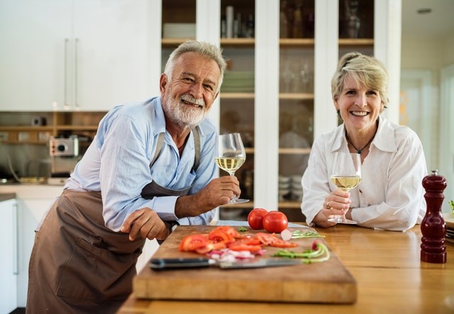 Grandparents enjoying their kitchen before selling their home